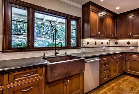 dark cabinets white counters stainless steel appliances with copper sink|dark blue kitchen cabinets.